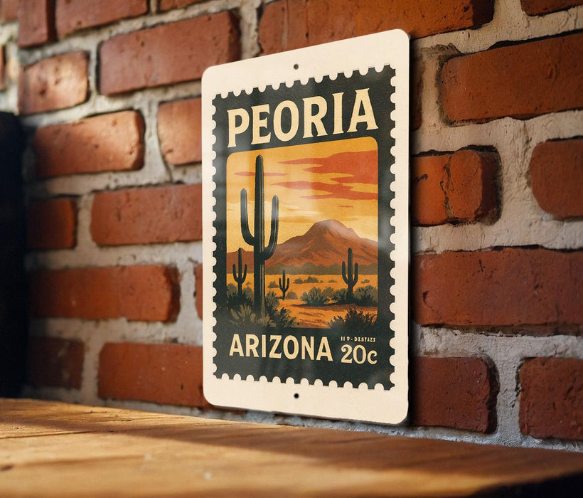 A vintage-style postage stamp from Arizona featuring a desert landscape with cacti and mountains, mounted on a brick wall.