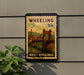A vintage-style postage stamp from West Virginia, featuring a bridge and a cityscape, is displayed on a wall.