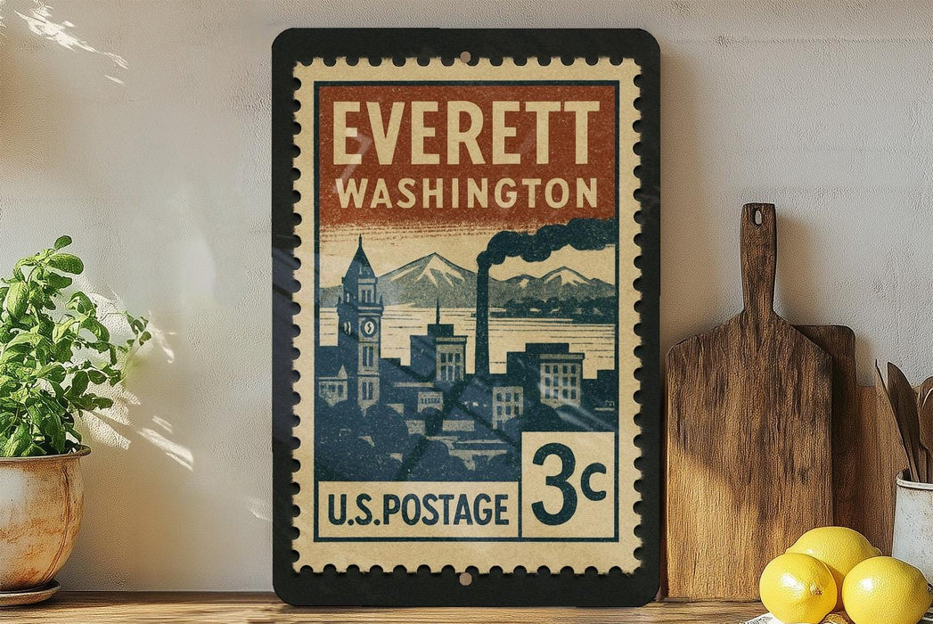 A vintage-style postage stamp from Everett, Washington, displayed on a shelf next to a wooden cutting board and some lemons.