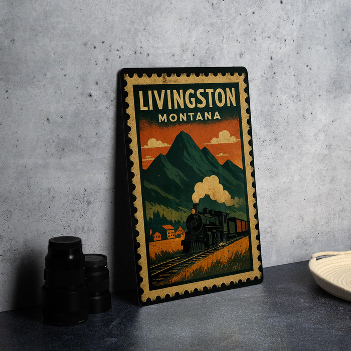 A vintage-style metal poster depicting a train traveling through a mountainous landscape, with the text "LIVINGSTON MOUNTAIN" prominently displayed.