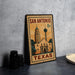 A vintage-style metal sign with the text "SAN ANTONIO 8c TEXAS" and an illustration of the Alamo, a famous landmark in San Antonio, Texas.