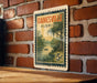 A vintage Florida postage stamp depicting a serene landscape with a river, trees, and a boat, mounted on a brick wall.
