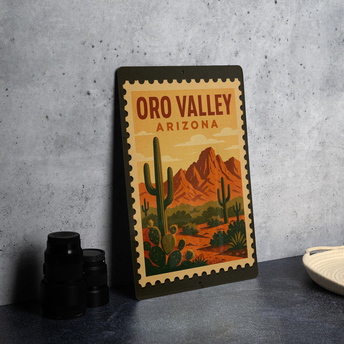 A framed poster of the Oro Valley in Arizona, featuring a desert landscape with cacti and mountains in the background.