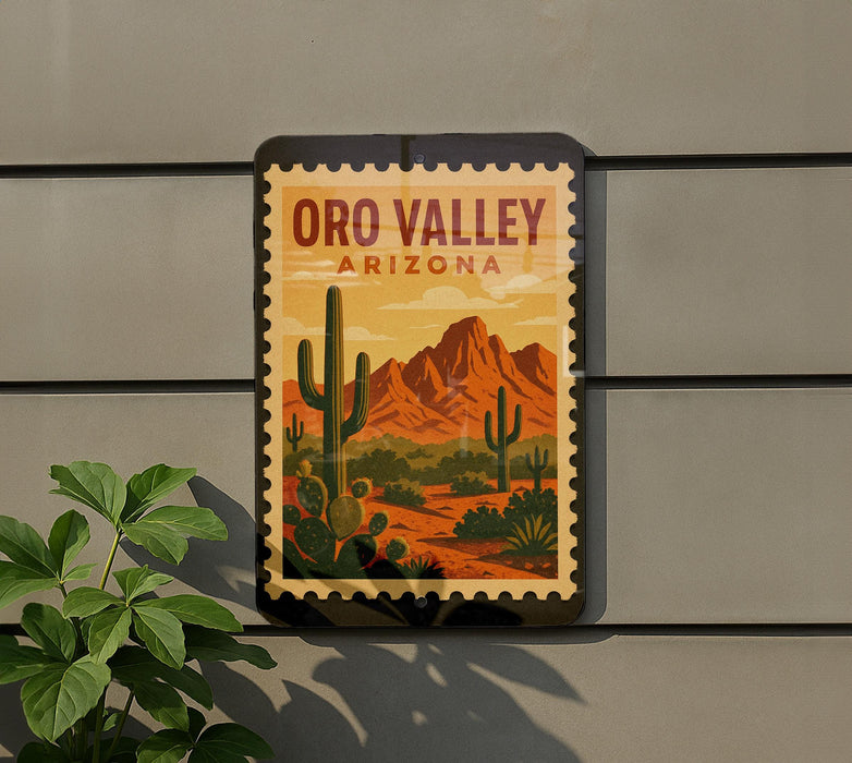 A framed poster of the Oro Valley in Arizona, featuring a desert landscape with cacti and mountains in the background.