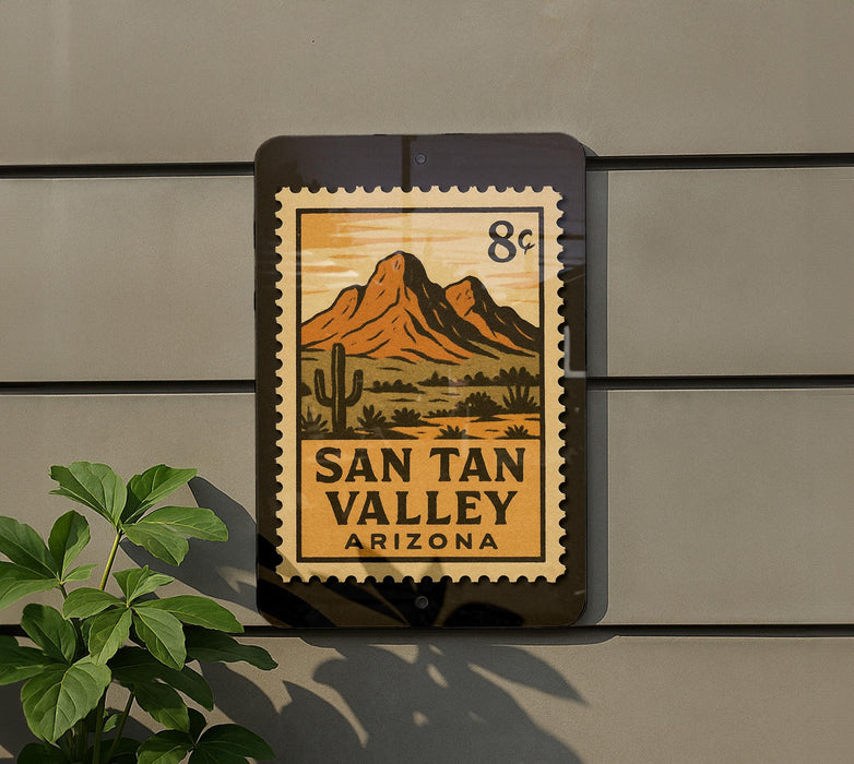 A sign for San Tan Valley, Arizona, featuring a mountain landscape and a cactus.
