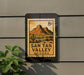 A sign for San Tan Valley, Arizona, featuring a mountain landscape and a cactus.