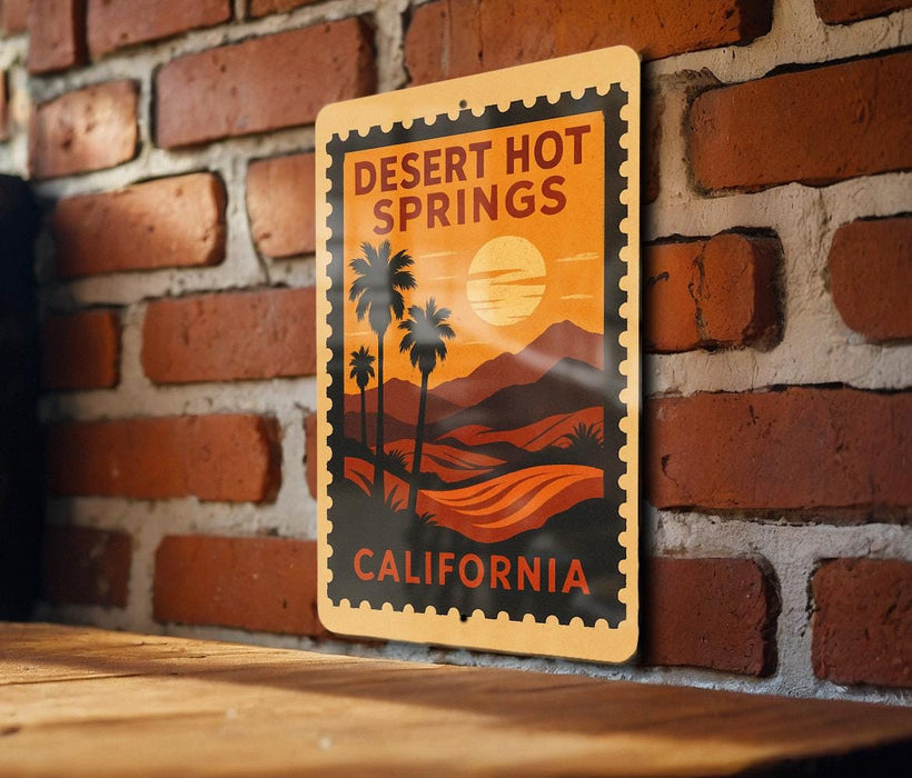 A vintage-style metal sign with a desert landscape and palm trees, mounted on a brick wall.