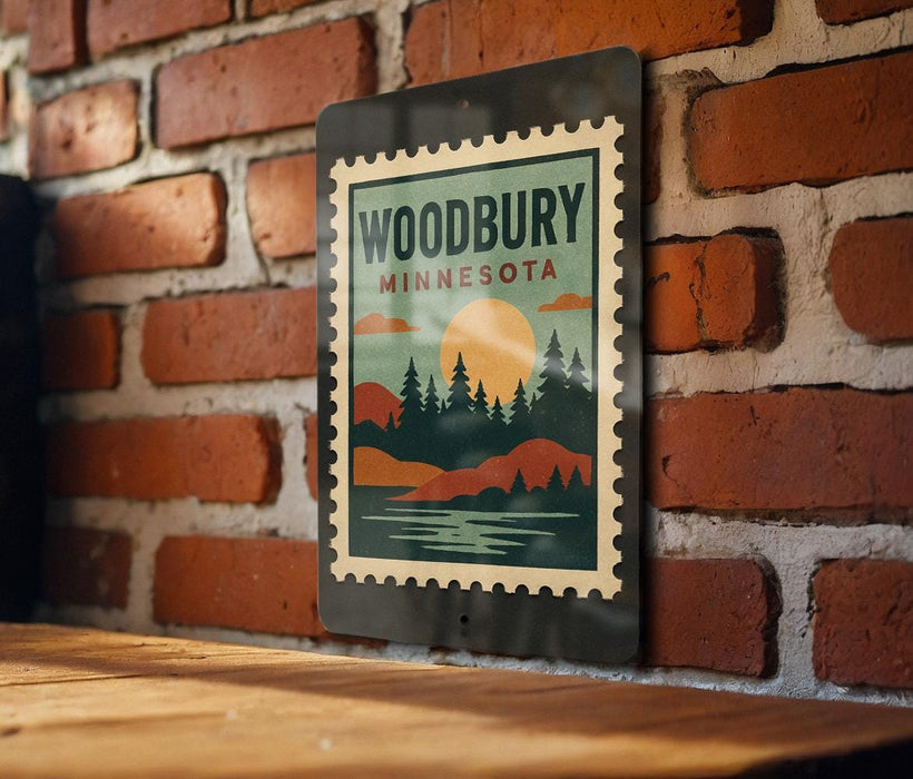 A vintage-style metal sign with the text "WOODBURY MINNESOTA" displayed on it, mounted on a brick wall.