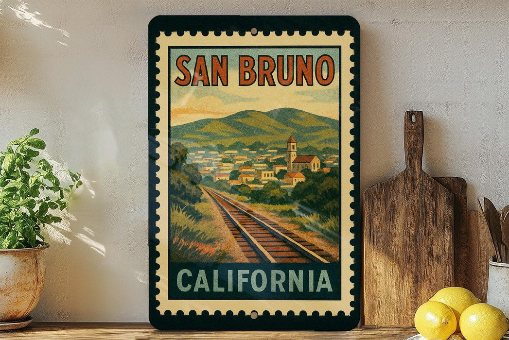 A vintage-style poster of San Bruno, California, featuring a train track and a town in the background, is displayed on a wall next to a wooden cutting board and some potted plants.