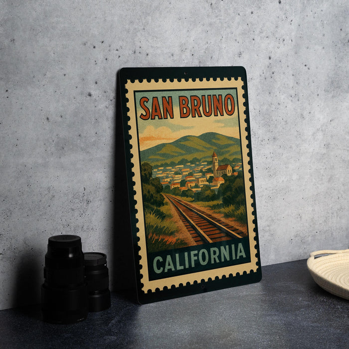 A framed vintage postage stamp depicting a scenic view of San Bruno, California, with a train track and mountains in the background.