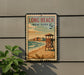 A vintage-style sign for Long Beach, New York, featuring a lifeguard tower and a beach scene.