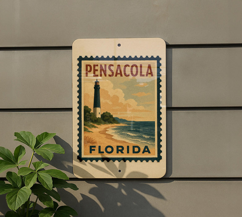 A sign for Pensacola, Florida, featuring a lighthouse and beach scene.