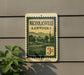 A vintage-style sign for Nicholasville, Kentucky, featuring a pastoral scene with a church and mountains in the background.