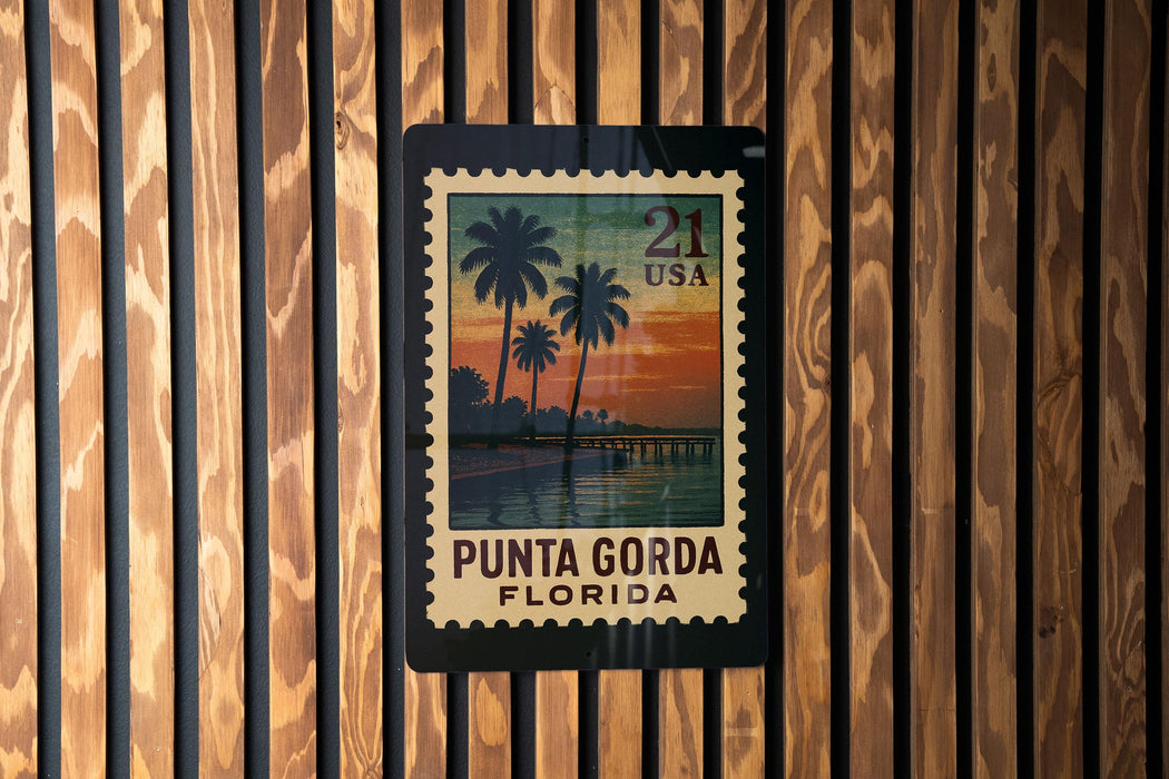 A postage stamp from the United States of America, featuring a tropical beach scene with palm trees and a sunset.