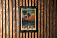 A postage stamp from the United States of America, featuring a tropical beach scene with palm trees and a sunset.