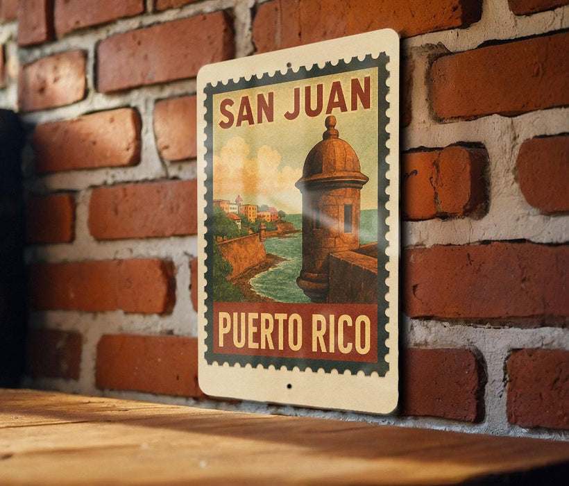 A vintage-style sign with the text "SAN JUAN PUERTO RICO" is displayed on a brick wall.
