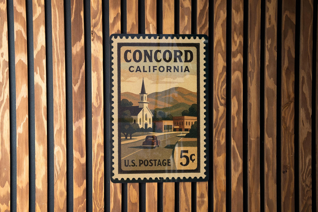 A U.S. postage stamp from Concord, California, featuring a church and mountains in the background.