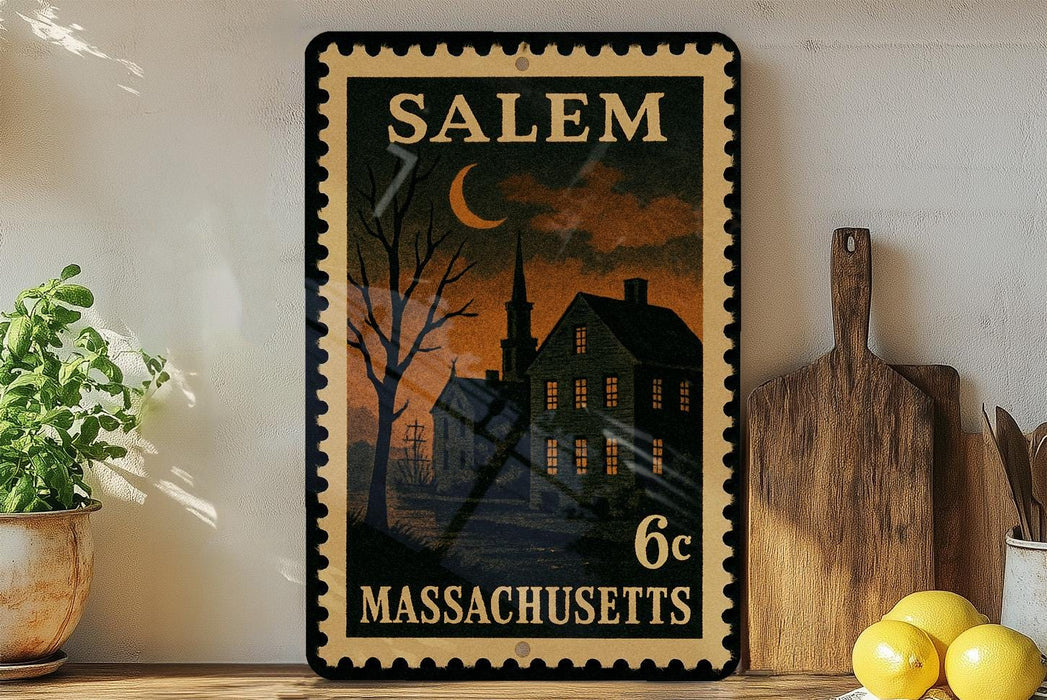 A framed vintage postage stamp from Salem, Massachusetts, featuring a nighttime scene of a house and a crescent moon.