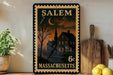 A framed vintage postage stamp from Salem, Massachusetts, featuring a nighttime scene of a house and a crescent moon.