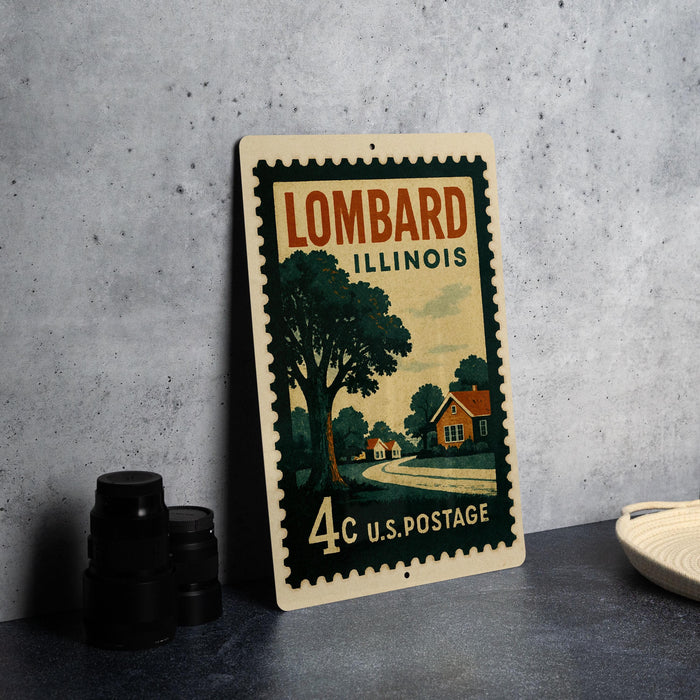 A vintage postage stamp from Illinois, featuring a rural scene with a house and trees, is displayed on a table.