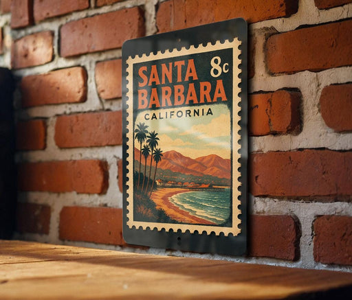 A vintage-style metal sign with the text "SANTA BARBARA CALIFORNIA" is displayed on a brick wall.