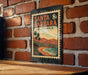 A vintage-style metal sign with the text "SANTA BARBARA CALIFORNIA" is displayed on a brick wall.
