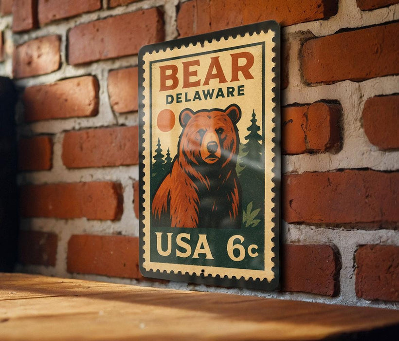 A metal sign featuring a bear and the text "BEAR DELAWARE" is displayed on a brick wall.
