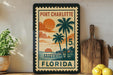 A vintage-style postage stamp from Port Charlotte, Florida, featuring a tropical beach scene with palm trees and a sunset.