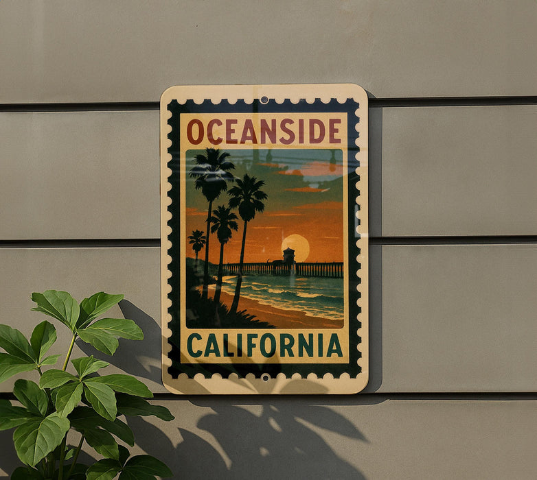 A vintage-style sign for Oceanside, California, featuring a sunset scene with palm trees and a pier.