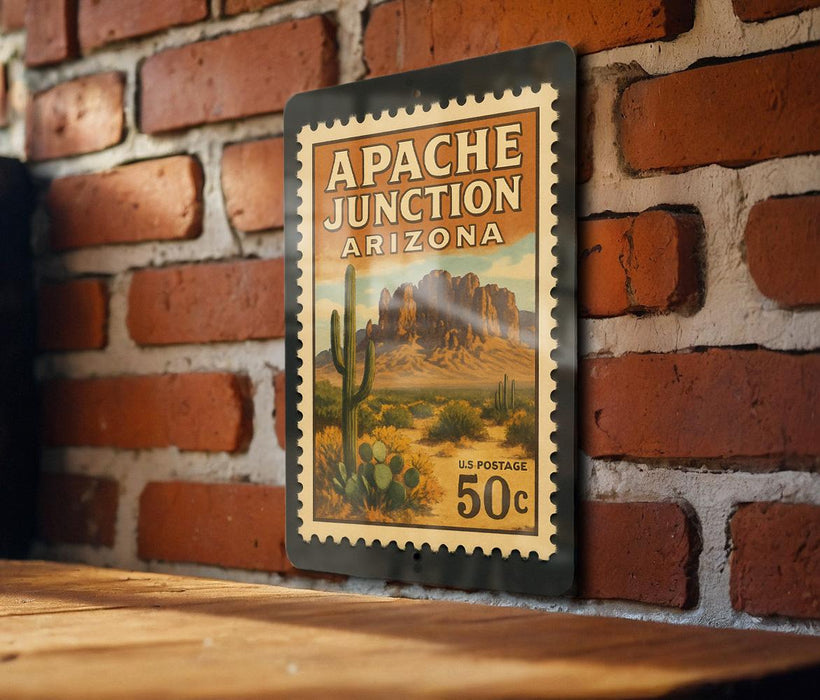 A vintage-style postage stamp depicting the Apache Junction, Arizona, with a desert landscape and cacti.