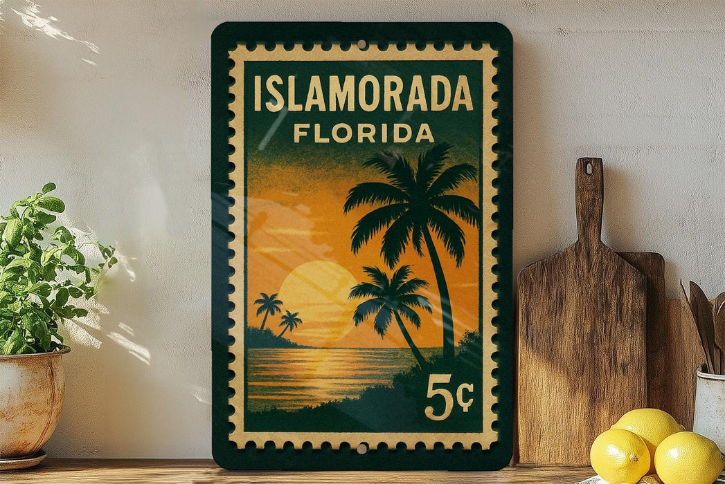 A framed poster of a tropical beach scene with palm trees and a sunset is displayed on a wall, accompanied by a wooden cutting board and a potted plant.