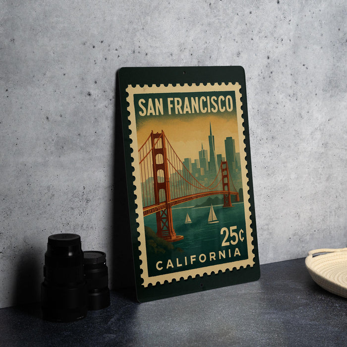 A framed vintage postage stamp depicting the Golden Gate Bridge in San Francisco, California, with the text "SAN FRANCISCO" and "25¢" printed on it.
