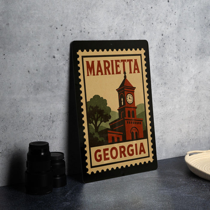 A framed poster of a clock tower in Marietta, Georgia, with the text "MARIETA GEORGIA" on it.