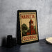 A framed poster of a clock tower in Marietta, Georgia, with the text "MARIETA GEORGIA" on it.