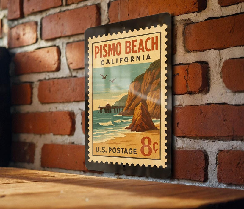 A vintage postage stamp from Pismo Beach, California, featuring a coastal scene with cliffs, a pier, and birds in flight.