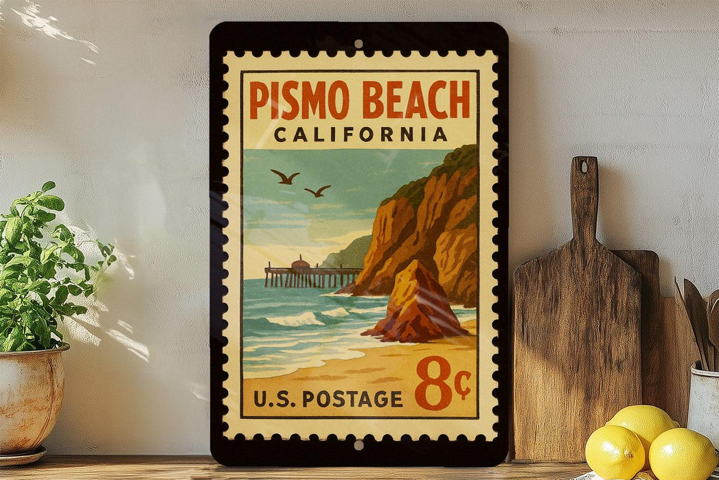 A vintage-style postage stamp depicting Pismo Beach, California, with a beach scene, pier, and mountains in the background.