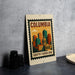 A metal sign with a colorful illustration of a city skyline and the text "COLUMBIA SOUTH CAROLINA" is displayed on a table.