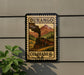 A vintage postage stamp from Durango, Colorado, featuring a steam locomotive and mountainous scenery.