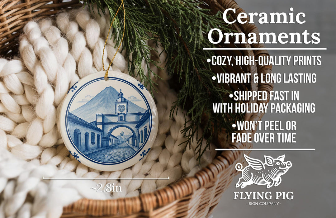 Ceramic ornaments, featuring a blue and white design of a building with a clock tower, are displayed in a basket.