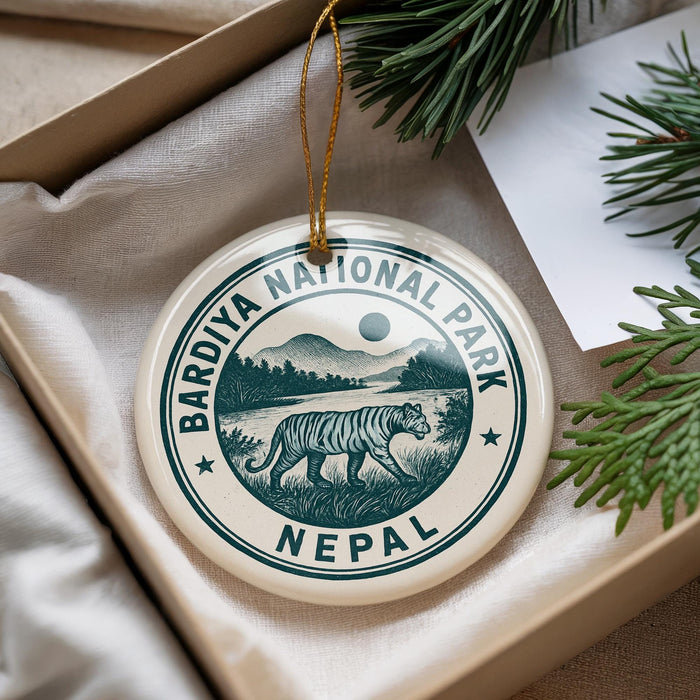 A decorative ornament with the text "Bardiya National Park Nepal" and an illustration of a tiger walking through a grassy landscape.