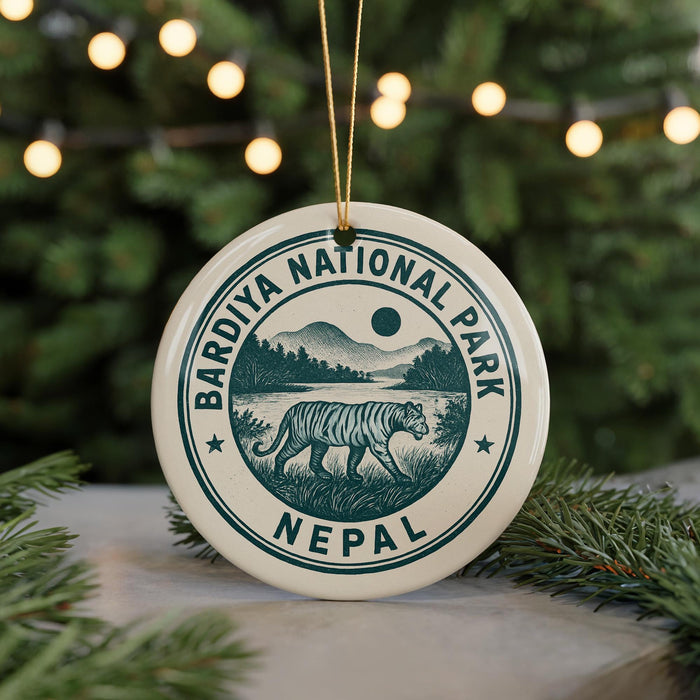 A circular ornament with the text "Bardiya National Park Nepal" and an illustration of a tiger walking through a grassy landscape.