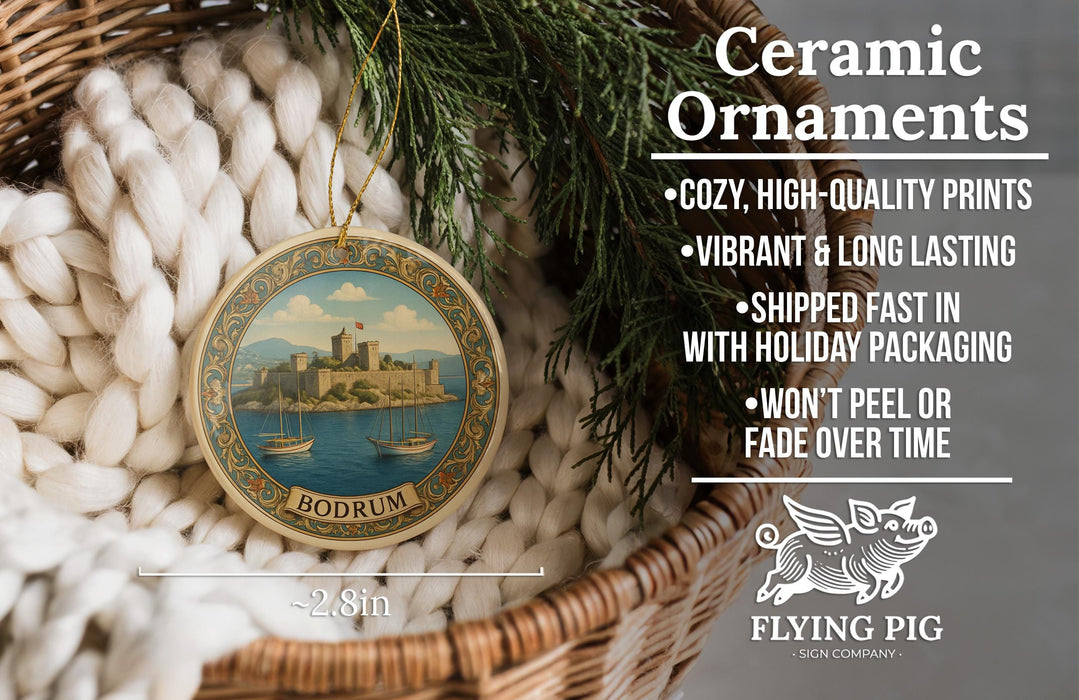 Ceramic ornaments, specifically a BODrum ornament, are displayed in a basket with pine branches. The ornament features a castle and boats, and it is described as a cozy, high-quality print, vibrant, and long-lasting. It is also shipped fast in holiday packaging and won't peel or fade over time. The image is a collage of various images, and it is not a single image but a collection of images.