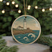 A round ornament featuring a lighthouse on a cliff overlooking the ocean, with waves crashing against the shore.