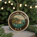 A circular ornament with the text "CATALINA ISLAND" and "U.S.A." printed on it, featuring a scenic image of Catalina Island with a building, palm trees, and boats in the water.