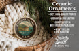 Ceramic ornaments, featuring a round ornament with a design of Catalina Island, U.S.A. and a wicker basket with pine branches and greenery.