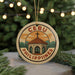 A round ornament with the text "CEBU PHILIPPINES" and an illustration of a church or cathedral, surrounded by Christmas lights and greenery.