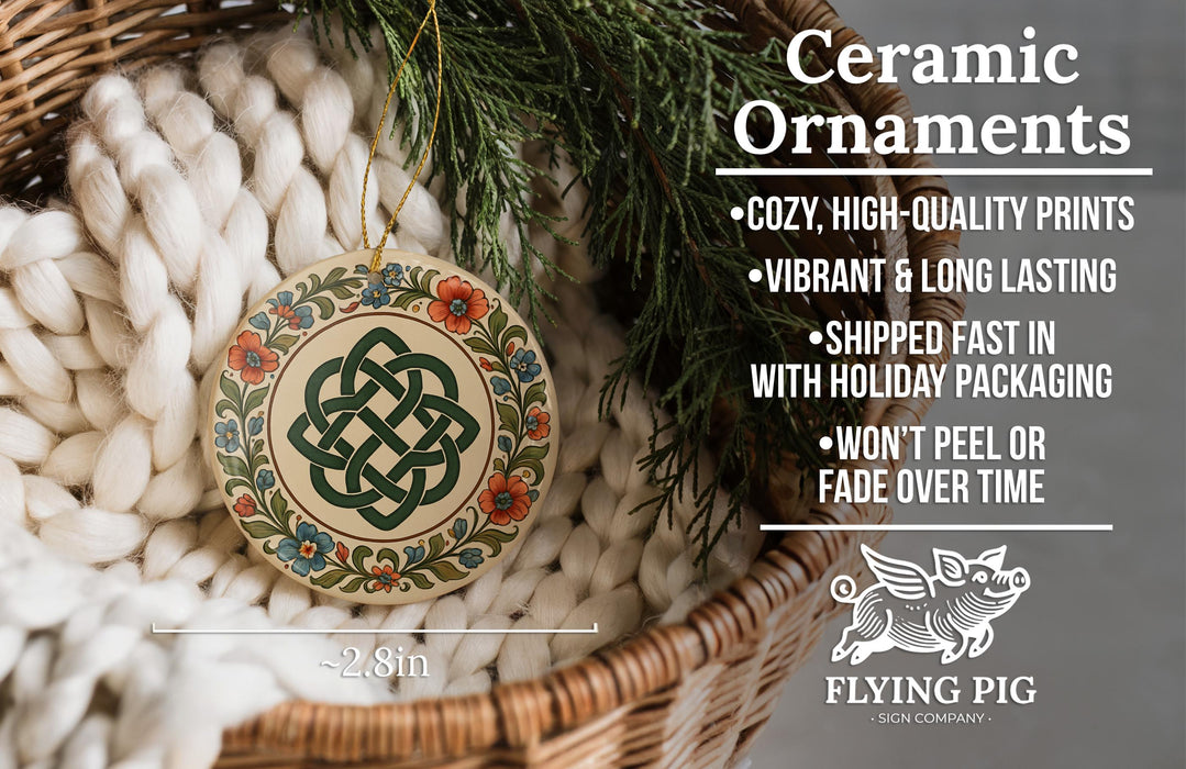 Ceramic ornaments, featuring a decorative design with a Celtic knot, are displayed in a wicker basket.