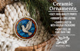 Ceramic ornaments, featuring a stained glass design of a dove in flight, are displayed in a wicker basket.