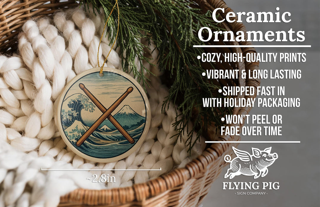 Ceramic ornaments, featuring a ceramic ornament with a wave design and a ceramic ornament with a mountain design, are displayed in a woven basket.