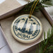 A decorative ornament featuring the skyline of Dubai, United Arab Emirates, with the Burj Khalifa tower prominently displayed.
